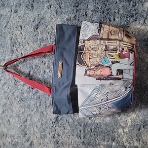 Nicole Lee Paris purse with 6 pockets. Great for makeup.
